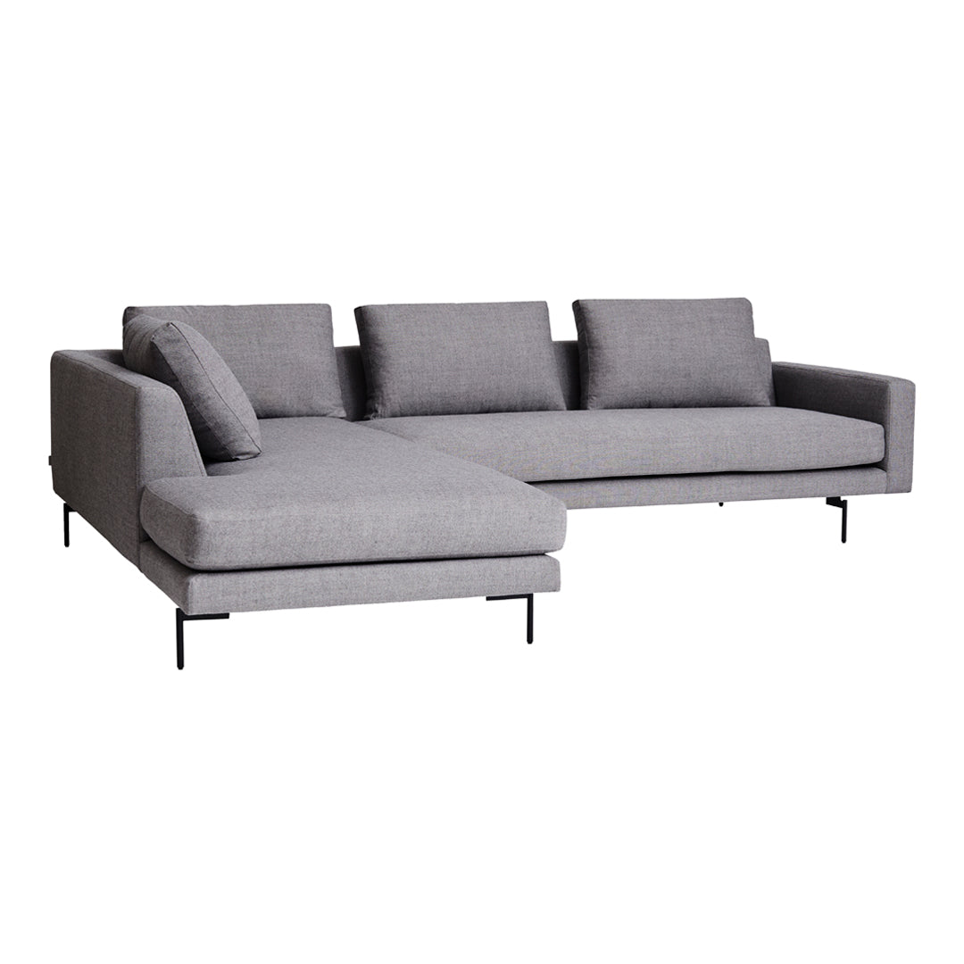 Gray sectional sofa with a sleek design and smooth fabric, featuring solid colors and minimalistic patterns.