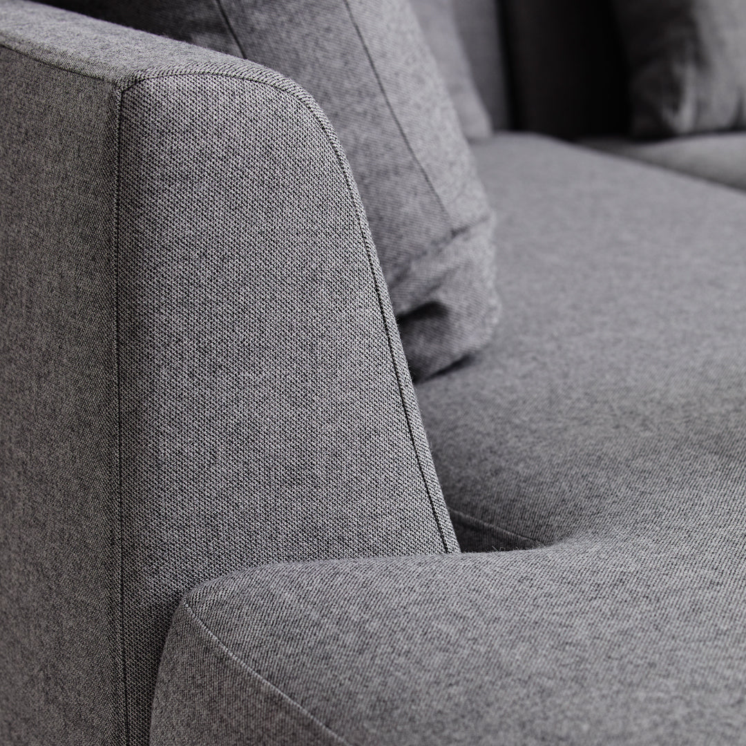 Gray textured fabric with a subtle heather pattern, showcasing modern elegance and comfort.