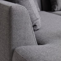 Gray textured fabric with a subtle heather pattern, showcasing modern elegance and comfort.