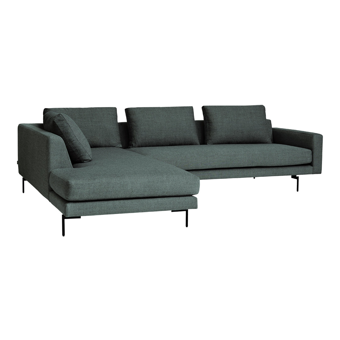 Stylish dark teal sectional sofa with a sleek fabric texture and minimalist design, featuring plush cushions.