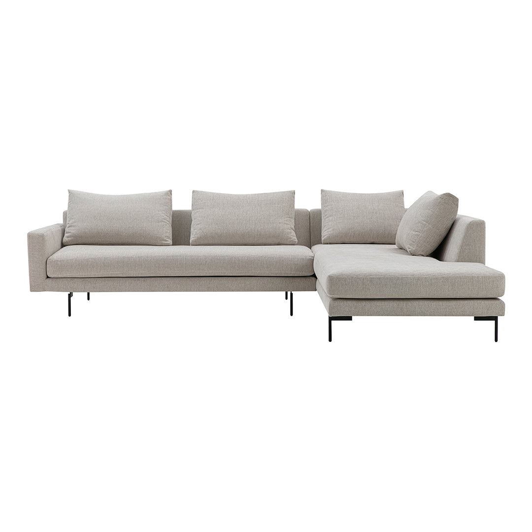 Light beige sectional sofa with sleek black metal legs and modern minimalist design. Soft fabric upholstery and plush cushions.