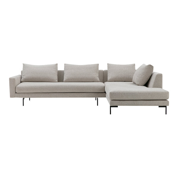 Light beige sectional sofa with a sleek design and plush cushions, featuring a modern minimalist aesthetic.
