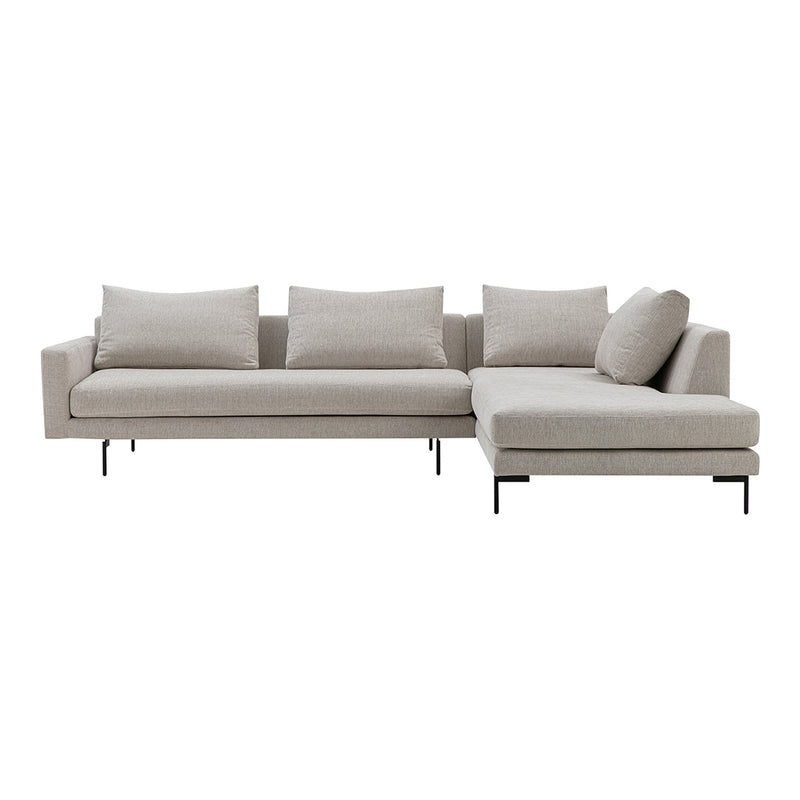 Light beige sectional sofa with a sleek design and plush cushions, featuring a modern minimalist aesthetic.