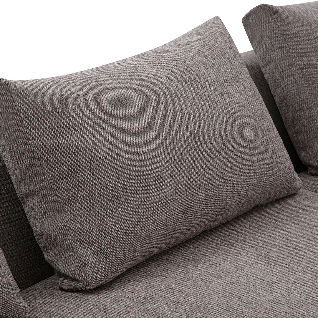 Textured gray sofa cushion with a subtle heather pattern, complementing modern home decor styles.