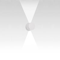 Minimalist white wall fixture with a smooth circular design, featuring a subtle gradient and clean lines.