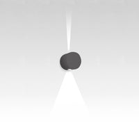 Sleek black wall light casting a soft white beam, modern minimalist design against a gradient gray background.