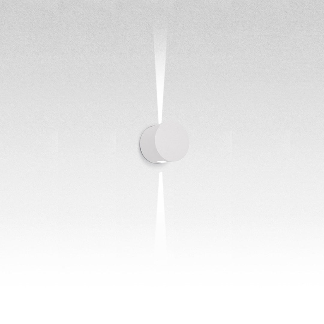 White minimalist wall light with a sleek, smooth surface and radiant light pattern. Ideal for modern decor.