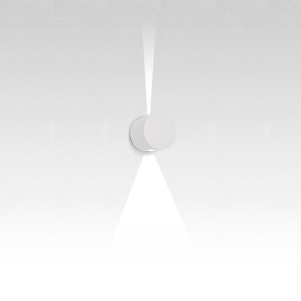 Minimalist white wall light with a sleek design and soft glow, emphasizing modern elegance and simplicity.