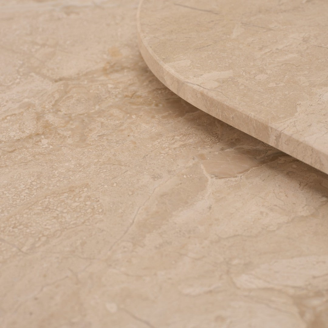 Beige marble surface with smooth texture and subtle natural veining patterns. Ideal for elegant home decor.