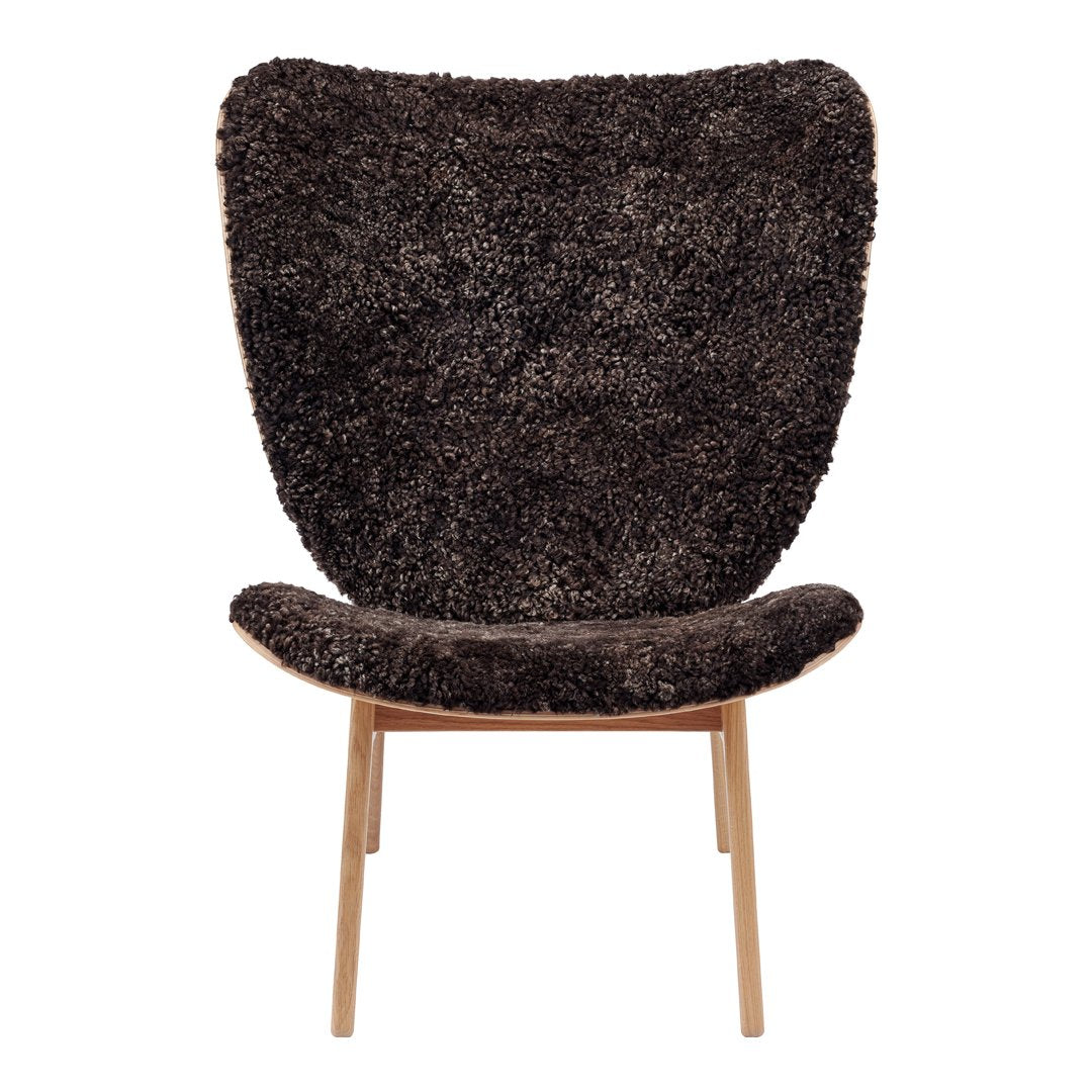 Textured dark brown chair with a soft, shaggy finish and slim wooden legs, perfect for modern decor.