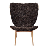 Textured dark brown chair with a soft, shaggy finish and slim wooden legs, perfect for modern decor.