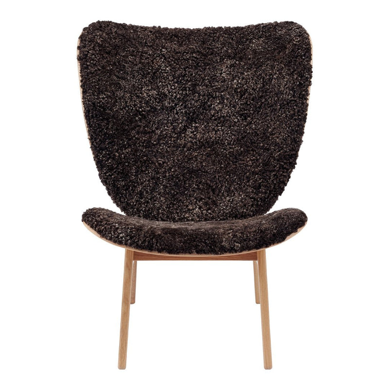 Textured dark brown chair with a soft, shaggy finish and slim wooden legs, perfect for modern decor.