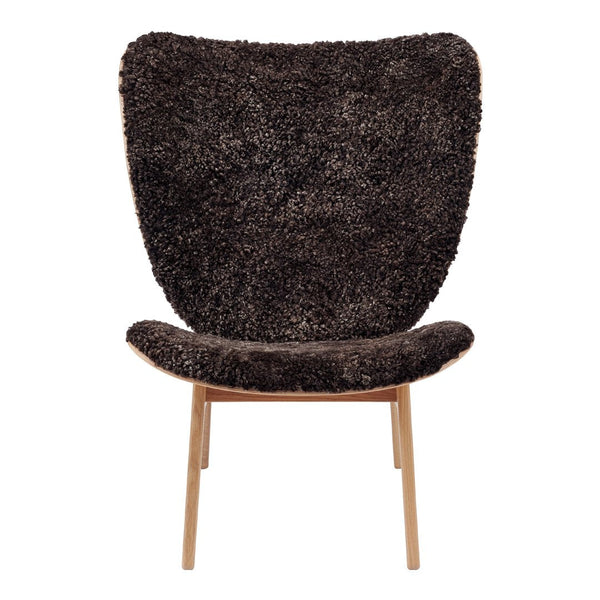 Textured dark brown chair with a soft, shaggy finish and slim wooden legs, perfect for modern decor.