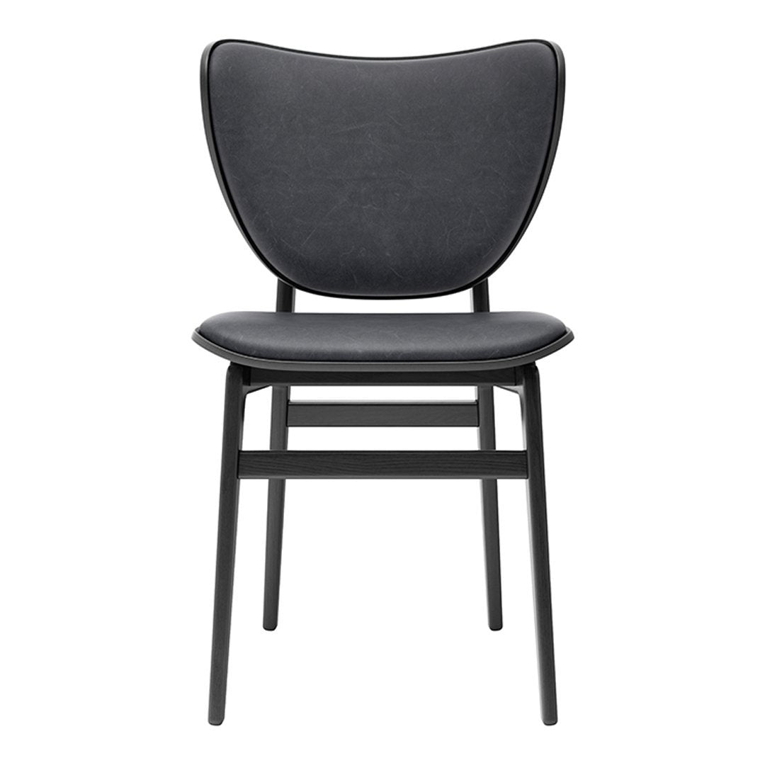Black modern chair with a smooth, curved seat and backrest design, featuring sleek black legs.