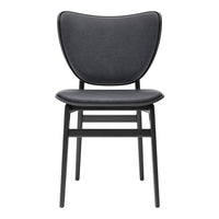Black modern chair with a smooth, curved seat and backrest design, featuring sleek black legs.