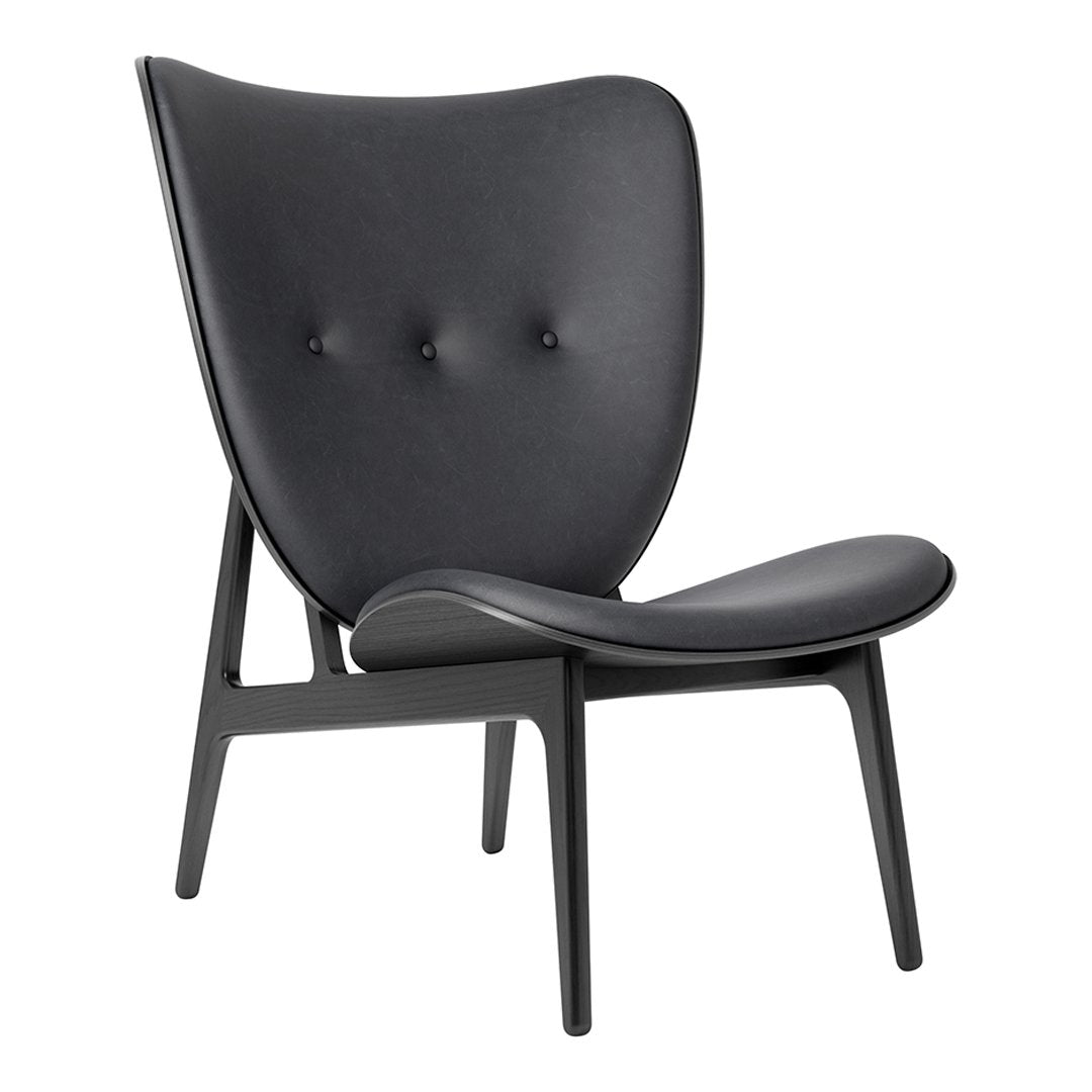 Stylish black lounge chair with minimalist design and subtle tufted pattern for modern interiors.