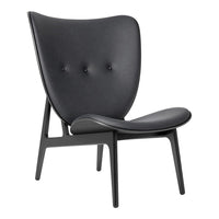 Stylish black lounge chair with minimalist design and subtle tufted pattern for modern interiors.