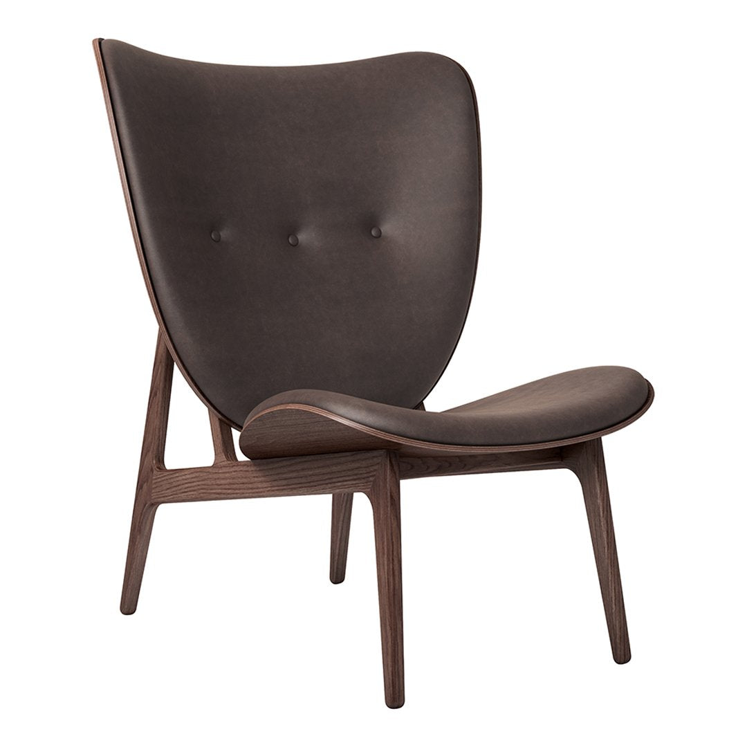 Brown upholstered chair with a smooth, curved design and button detailing, set on a natural wood frame.