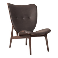Brown upholstered chair with a smooth, curved design and button detailing, set on a natural wood frame.