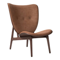 Brown upholstered chair with a smooth, curved design and wooden legs, featuring a minimalist, modern aesthetic.
