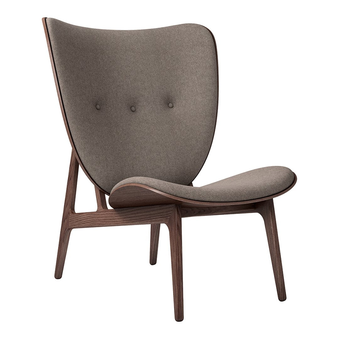 Mid-century modern chair in soft gray fabric with subtle tufted accents and wooden legs. Clean, minimalist design.
