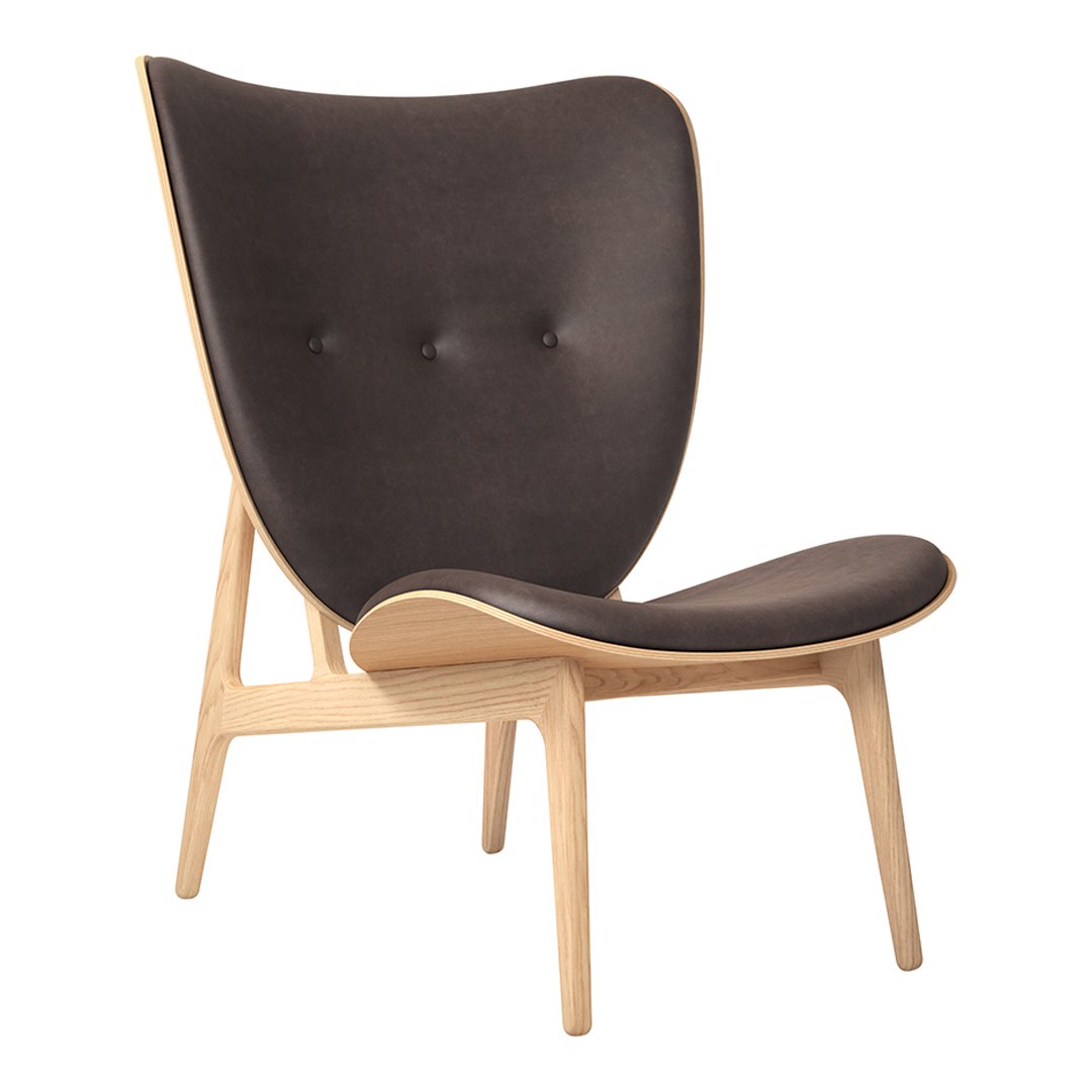 Mid-century modern chair in dark gray upholstery with wooden legs and minimal button tufting. Elegant and versatile design.