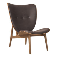 Dark brown upholstered chair with a smooth, curved shape and wooden legs, featuring a subtle button-tufted pattern.