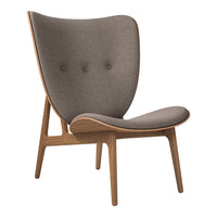 Gray upholstered chair with a minimalist wooden frame and subtle tufted detailing. Perfect for modern decor.