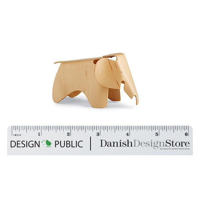 Light wood elephant figurine with smooth finish, showcasing natural grain and simple design. Perfect for decor or gifting.
