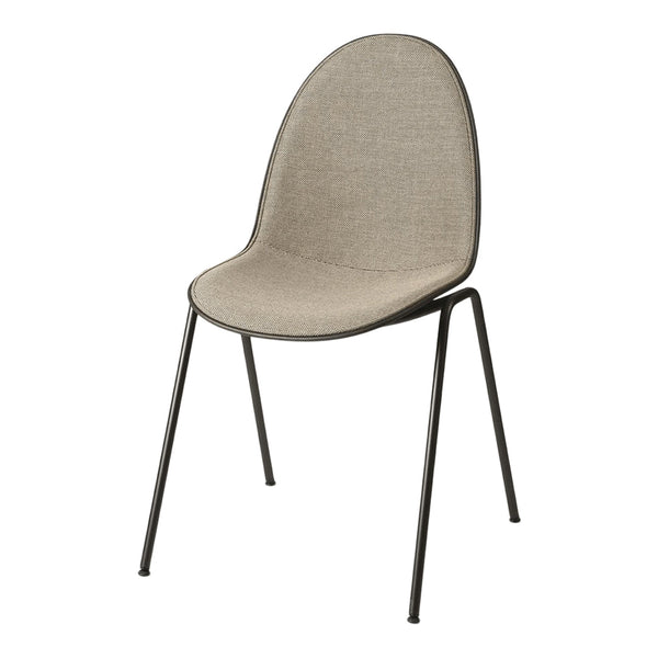 Light beige upholstered chair with a smooth, rounded backrest and sleek black metal legs.