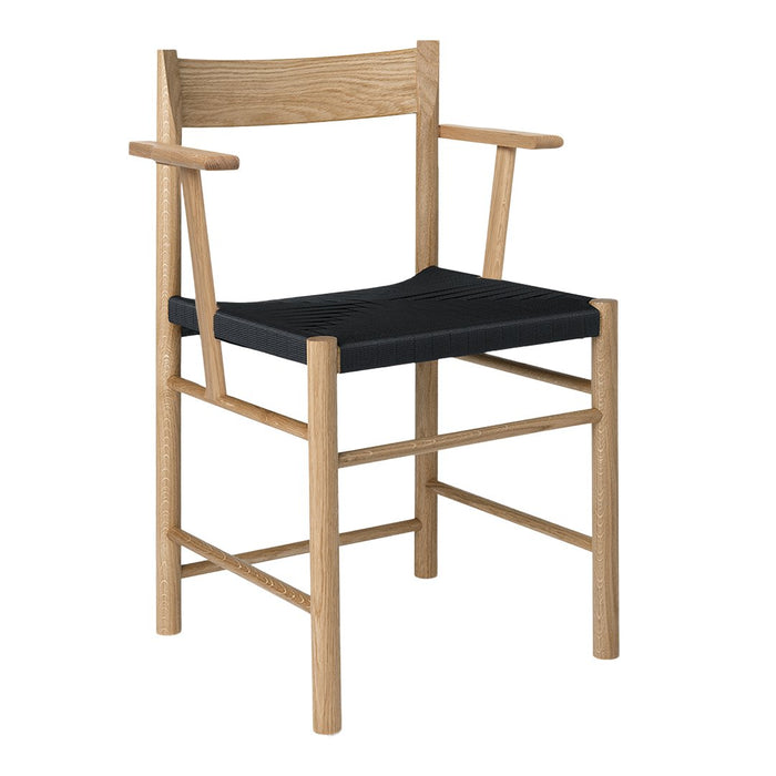 "Light wood frame with a black seat, showcasing a minimalist design and a contemporary aesthetic."