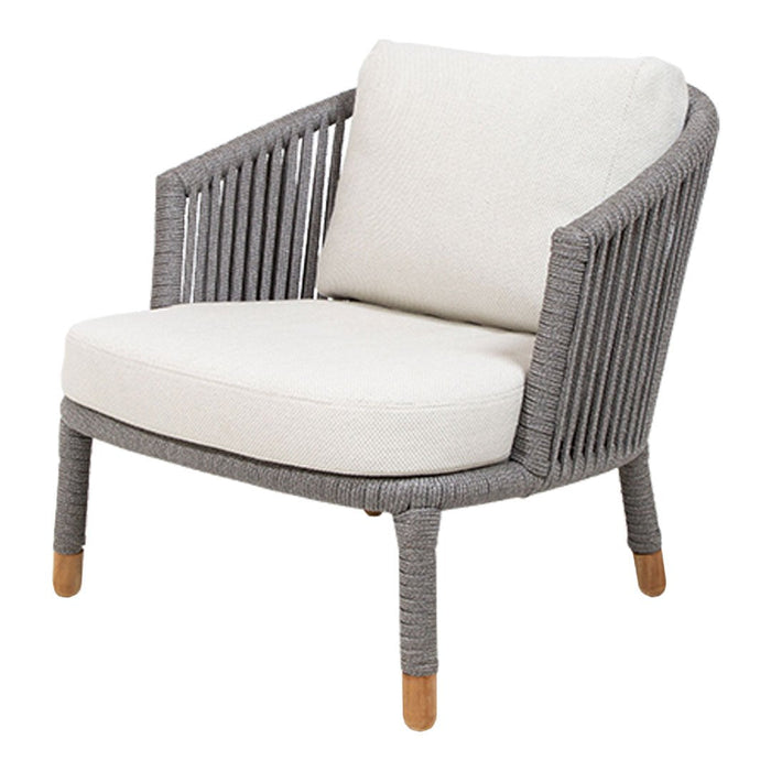 Gray woven chair with cream cushion and natural wood legs, perfect for a modern decor accent.
