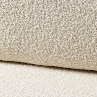 Soft beige textured fabric featuring a plush, cozy pattern with subtle variations in shades. Perfect for home decor.
