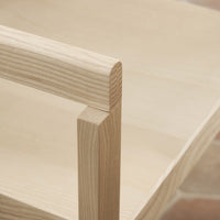 Light blond wood with subtle grain patterns, showcasing a minimalist design and natural finishing.