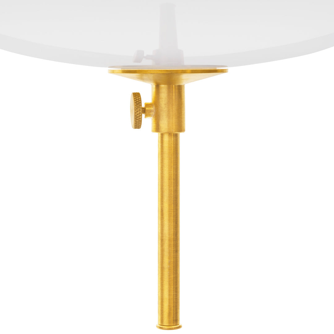 "Gold lamp stand with a smooth, polished finish and a clear glass shade, showcasing a sleek, modern design."