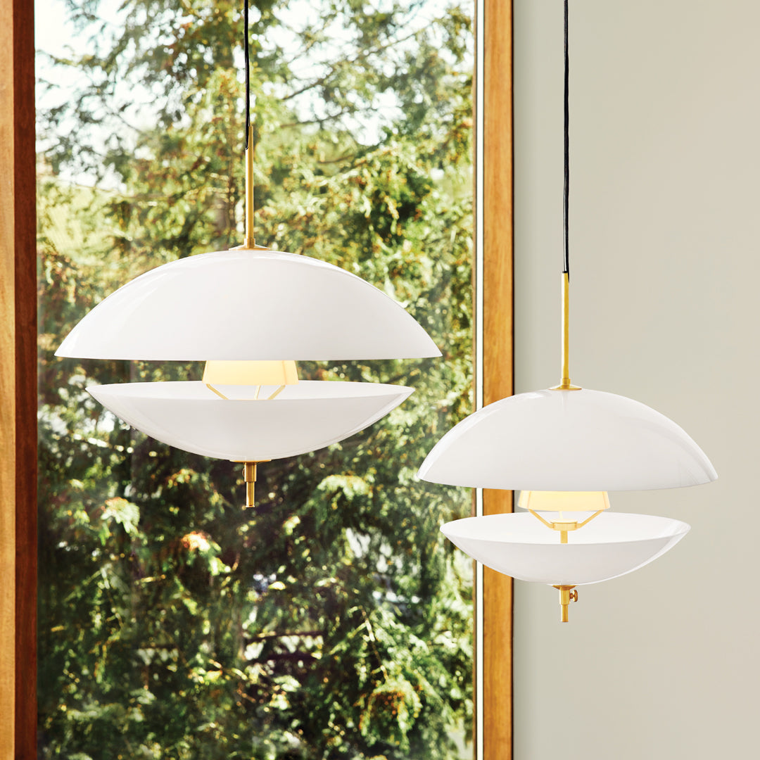 Modern pendant lights in white with gold accents, featuring a sleek, minimalist design and smooth, curved shapes.