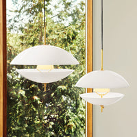 Modern pendant lights in white with gold accents, featuring a sleek, minimalist design and smooth, curved shapes.