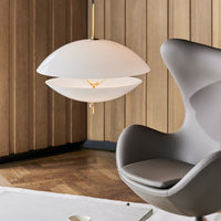 Modern pendant lamp in soft white with gold accents, featuring a sleek layered design, perfect for stylish interiors.