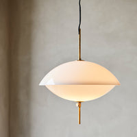 Elegant cream pendant lamp with a sleek rounded design and gold accents, perfect for modern decor.