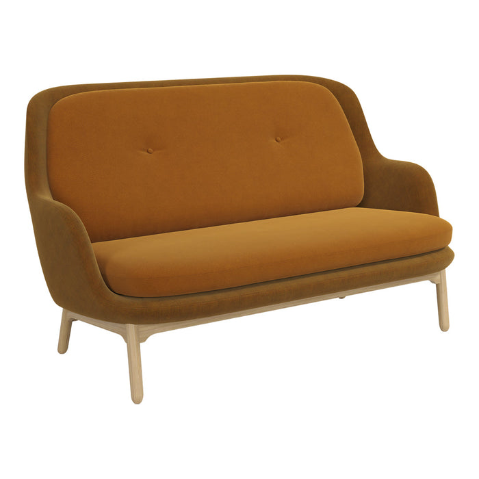 Velvet sofa in warm mustard yellow with smooth curves and minimalist wooden legs. Modern design, chic aesthetics.