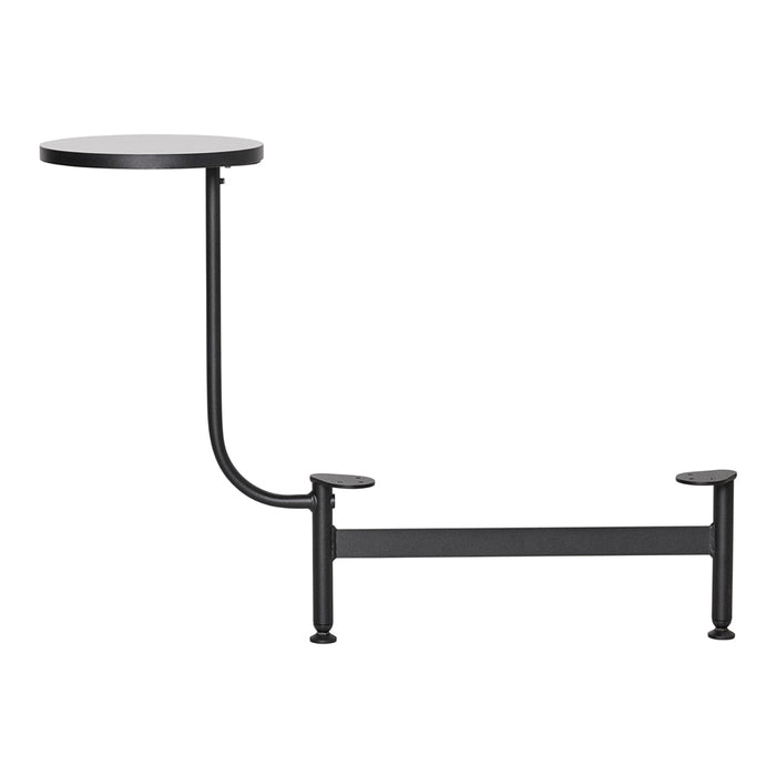 Black metal side table with a simple round top and curved leg design, showcasing a modern minimalist aesthetic.