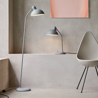 Gray floor and table lamps with sleek, minimalist design against a soft, neutral backdrop.