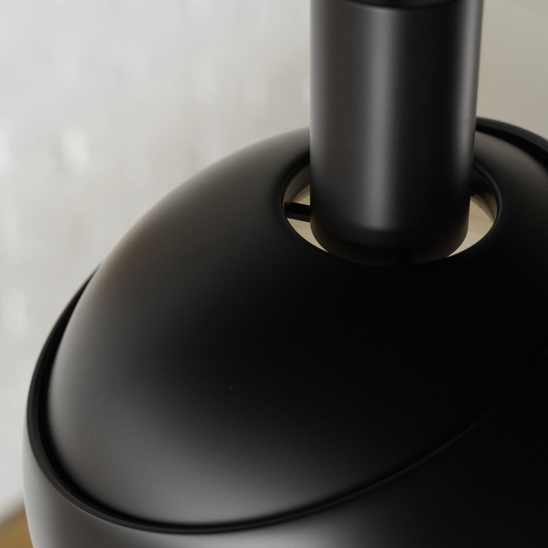 Close-up of a black lampshade with a blurred background