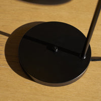 Black lamp on a wooden surface