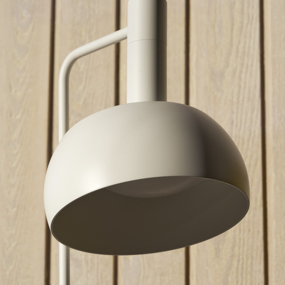 Modern outdoor wall light fixture on a wooden panel background