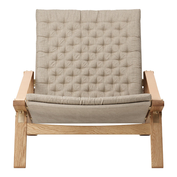 Beige tufted fabric lounge chair with a wood frame, featuring a minimalist design and soft texture. Perfect for modern decor.