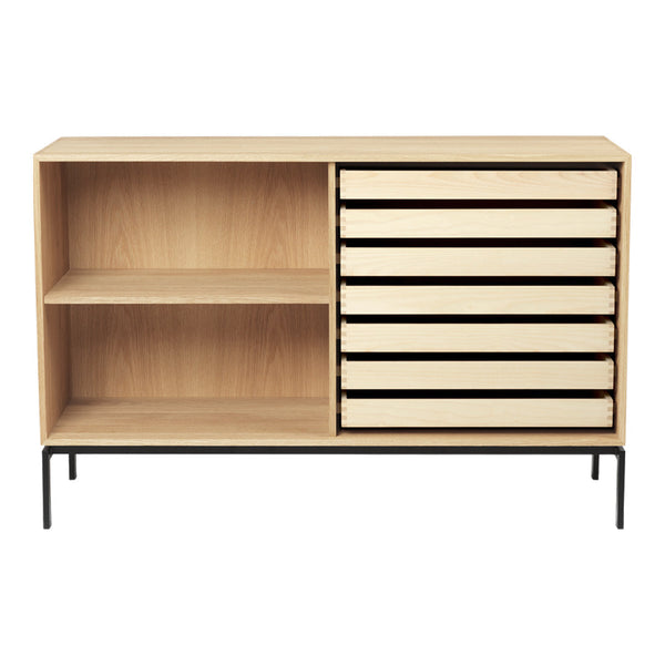 Light wood sideboard with six cream-colored drawers and a black metal base, featuring a minimalist design.