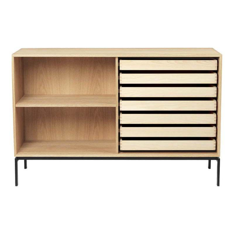 Light wood sideboard with six cream-colored drawers and a black metal base, featuring a minimalist design.