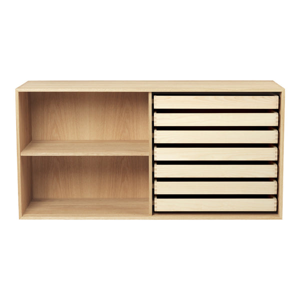 Light wood storage unit with a natural finish, featuring six sleek drawers and an open shelf in minimalist design.