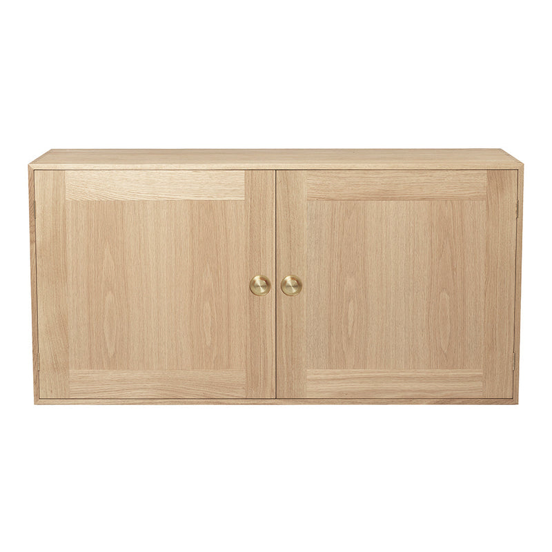 Natural wood grain cabinet with a light beige color and smooth finish, featuring subtle patterns and brass knobs.